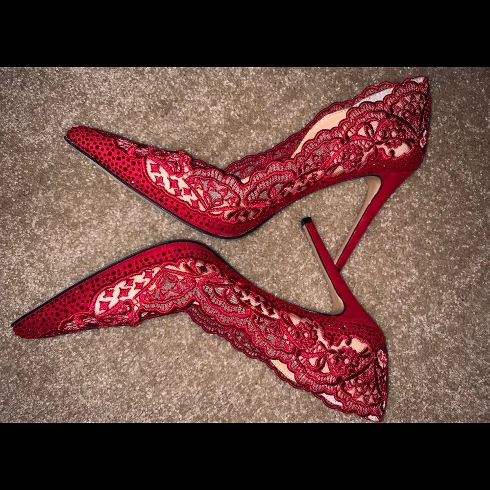 Red lace pumps